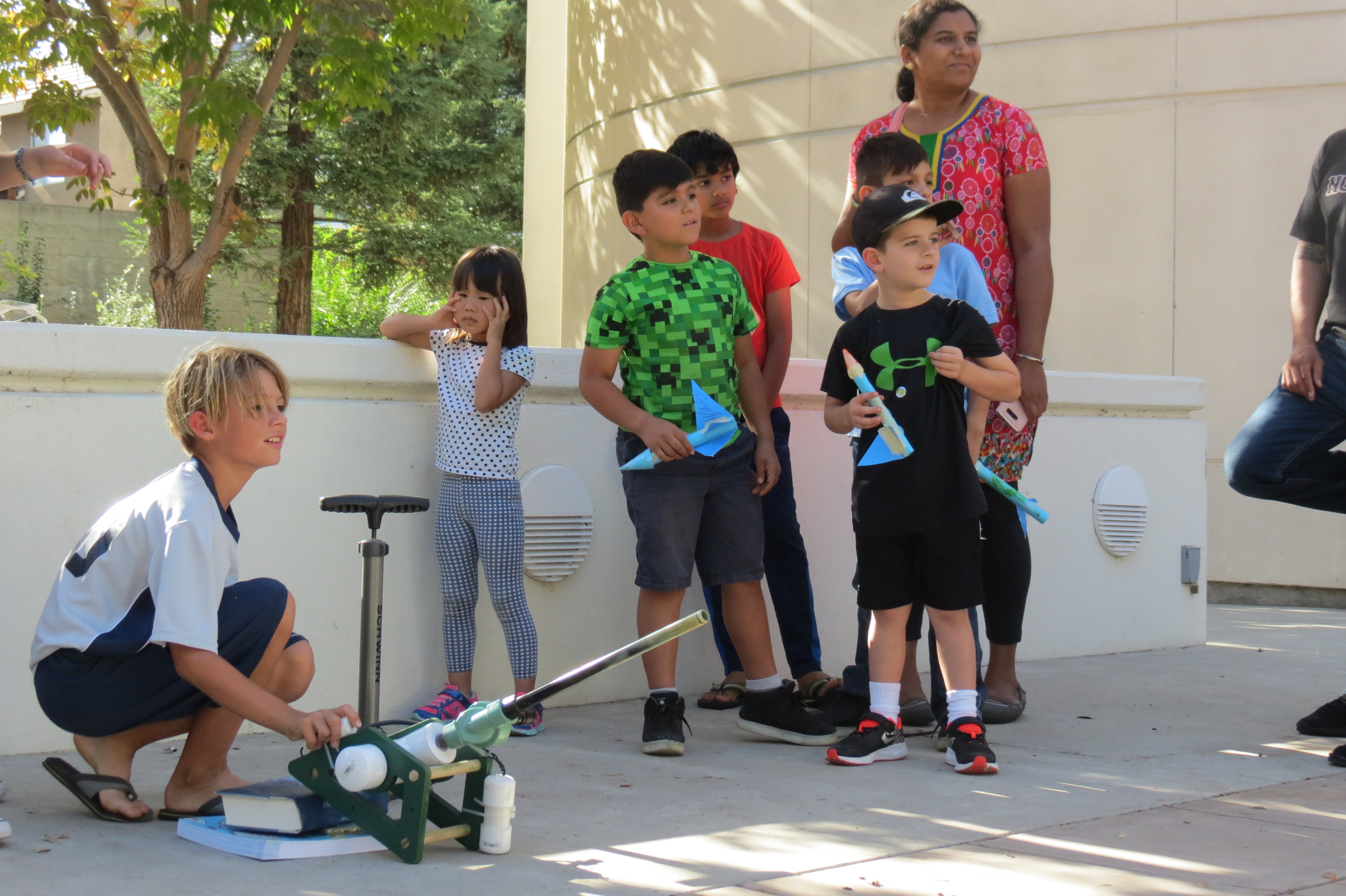 Children launching air rockets